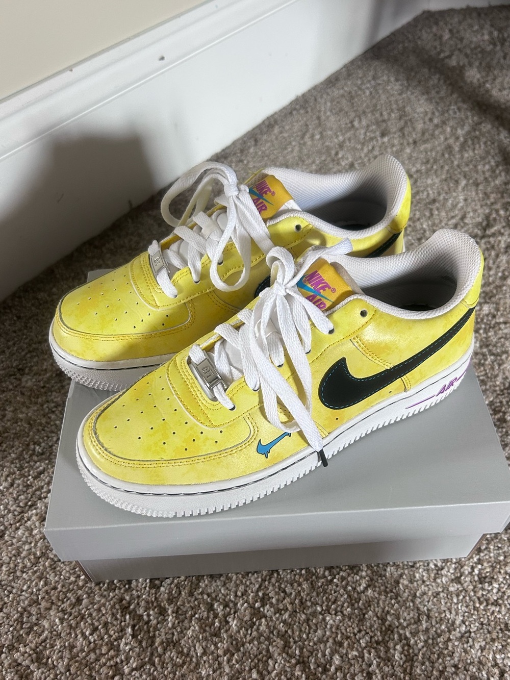 Nike Yellow Low-Top Sneakers with Black Swoosh